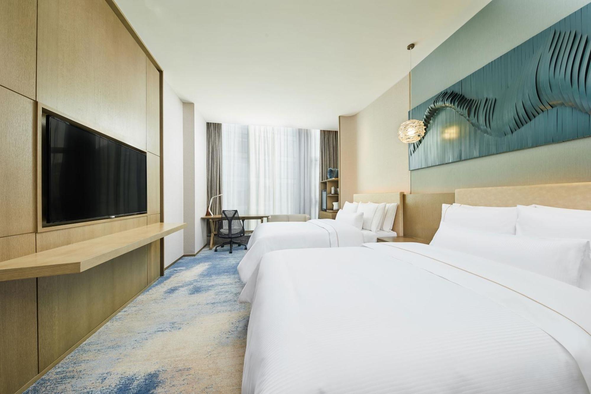 Отель The Westin Qingdao West Coast Экстерьер фото